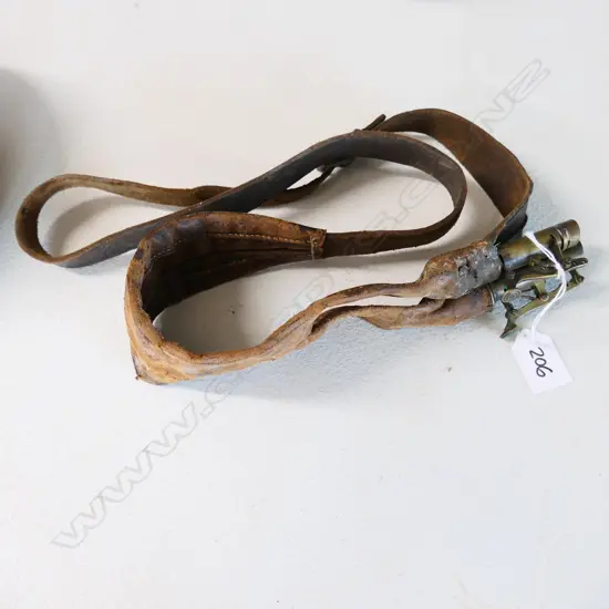 An over-the-shoulder leather double compartment shot pouch, with two brass lever action controlled nozzles.