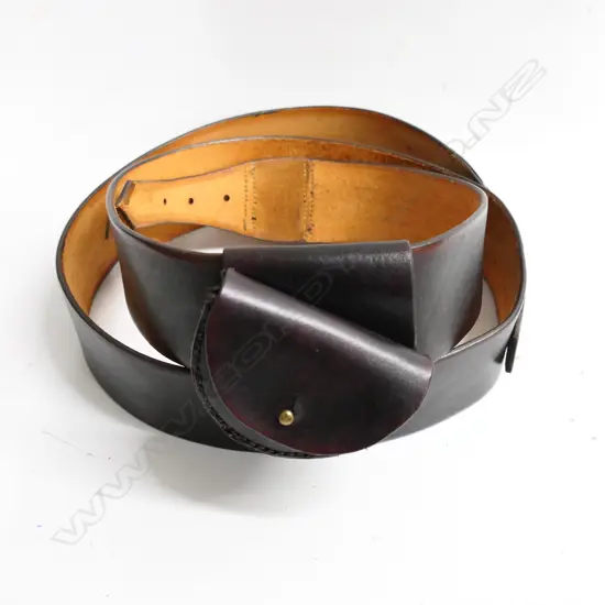 A reproduction 2¼" wide belt with pistol ammo pouch.  Inside of belt marked ‘WD 1859’ and ‘Moore Adams & Co C&M 1856 Christchurch’