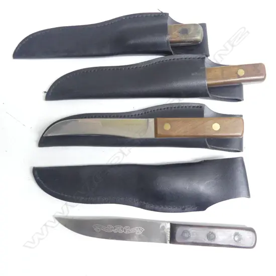 Four ‘New Zealand  Bushman’  knives with wooden grips and leather sheaths.
