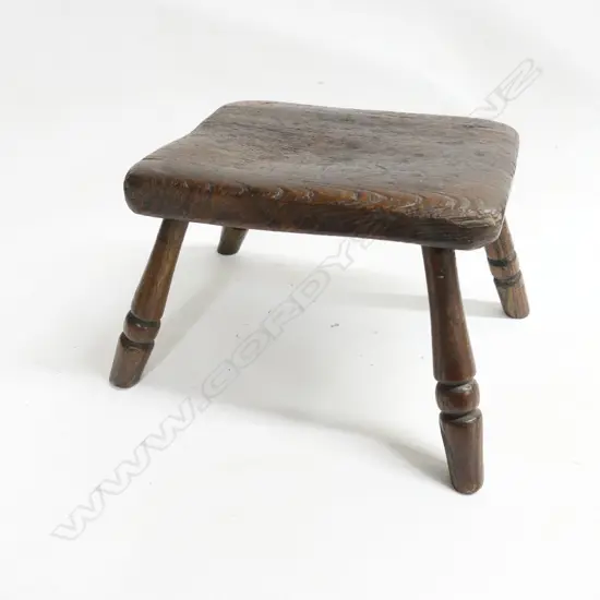 A small oak 19thC milking stool, with four turned legs, H.170mm
