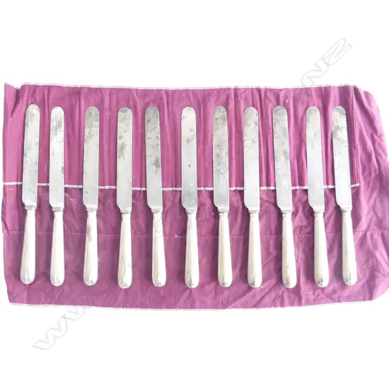 A set of eleven Victorian period silver handled table knives London 1894. The steel blades stamped Mappin and Webb, Sheffield, the wax filled handles with thread edge and raised drop