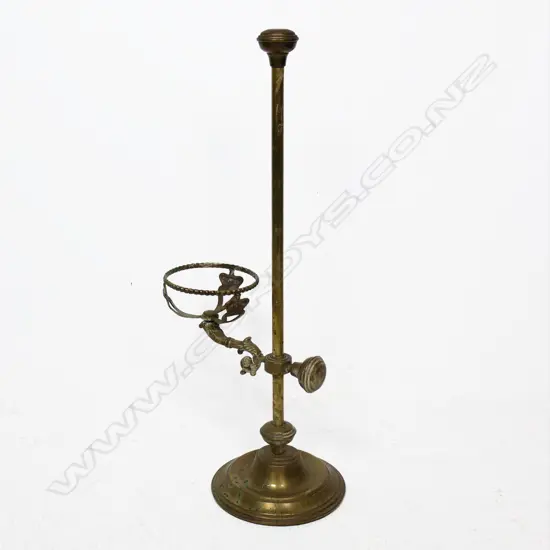 A brass adjustable paraffin lamp base. H.640mm
