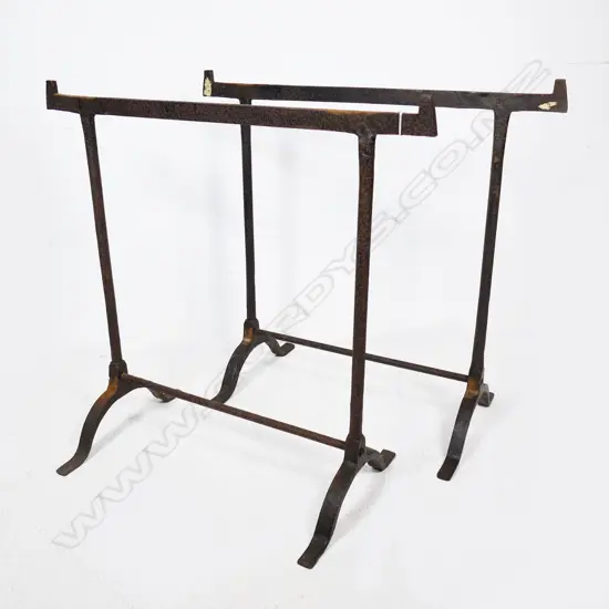 Two stirrup based wrought iron legs for a military campaign table, H.770mm