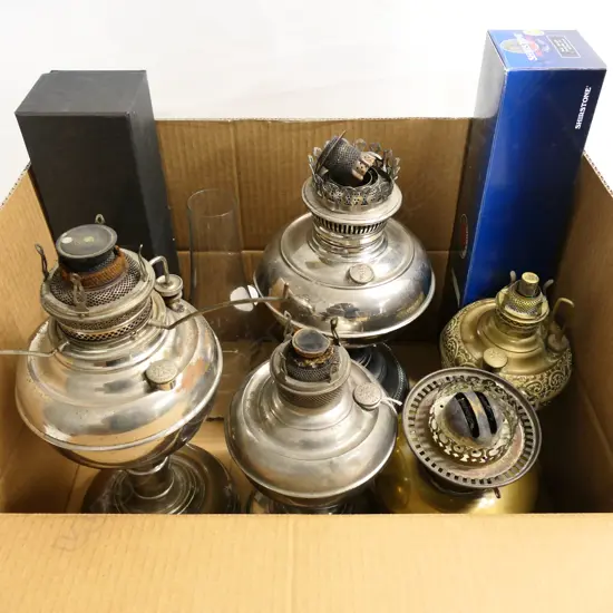 Five various paraffin lamps and three glass chimneys