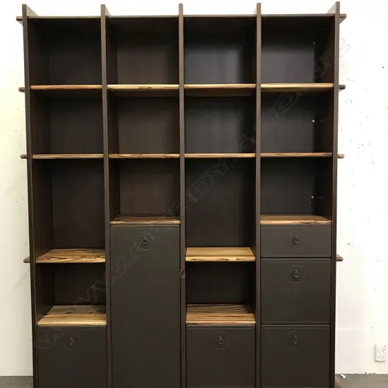 A large leather and tiger wood display unit