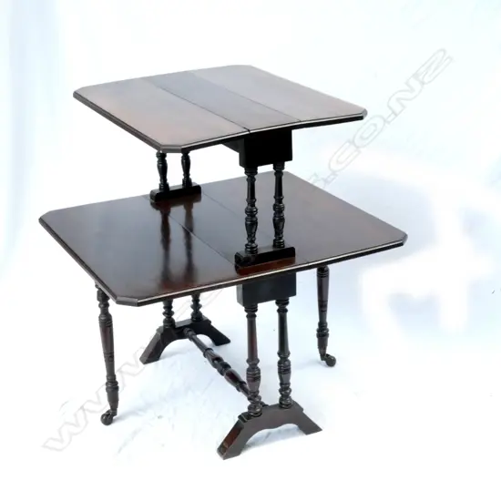 An Edwardian mahogany two-stage flat-top dumb waiter