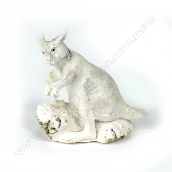A small carved antler figurine