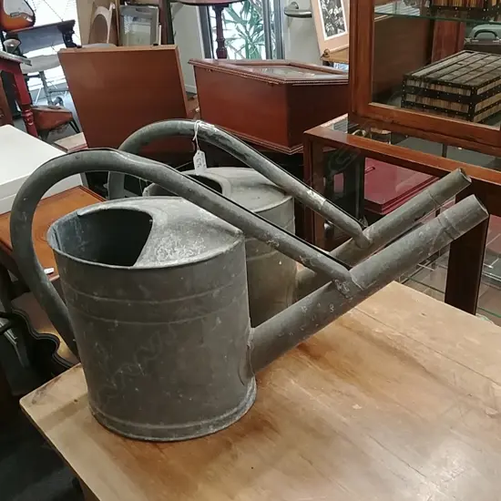2 VINTAGE WATERING CANS 