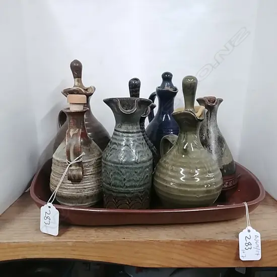 NZ POTTERY TRAY & 7 OIL BOTTLES