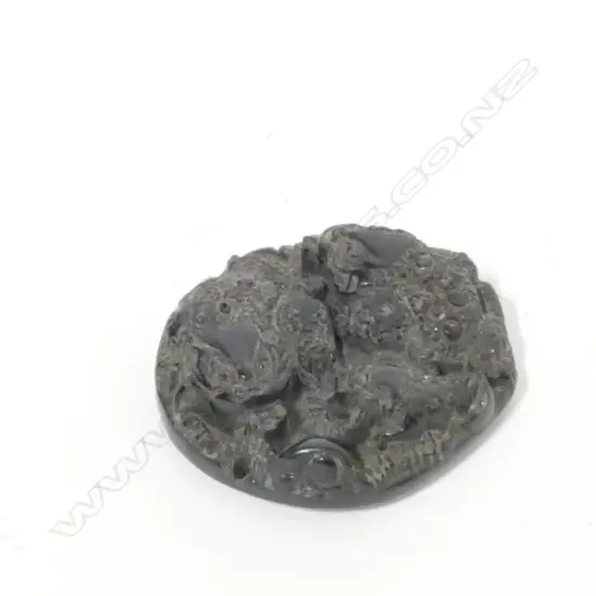 A Chinese black stone disc pendant