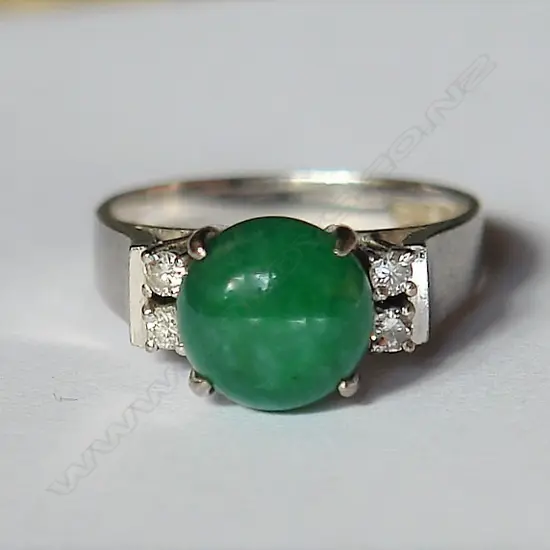 A vintage 14ct. white gold jade and diamond lady's dress ring