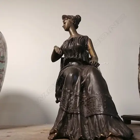 BRONZE SEATED LADY
