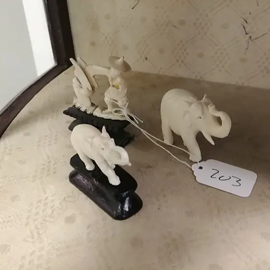 3 SMALL IVORY CARVINGS; 2 ELEPHANTS, MAN BIRD SHEL