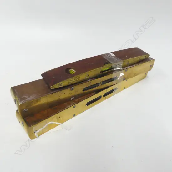Three brass/wood levels