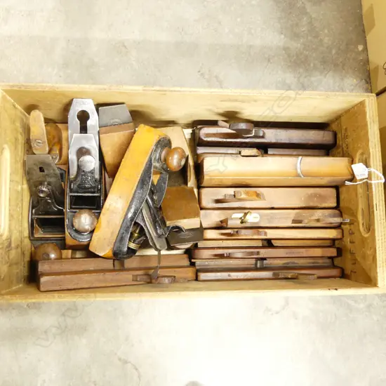 Box of wooden moulding planes, smoothing planes and transitional planes