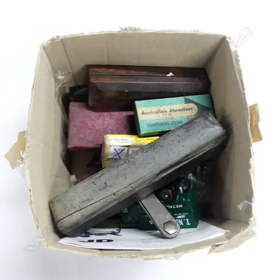 Box of miscellaneous tools, odds, metal rules, cigarette cards (tools), truck model, cast Aluminium Wilson logo, etc