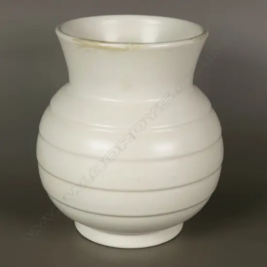 Crown Lynn cream hand potted vase of squat baluster shape with horizontal rings,