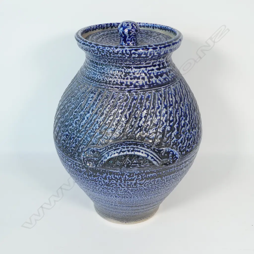 Mirek Smisek (1925–2013) substantial salt glazed lidded storage jar, deep blue glaze with band of repeating cut design around the shoulder. Maker's stamp lower side. A good well glazed example of his larger work. H.440mm. Image 1++