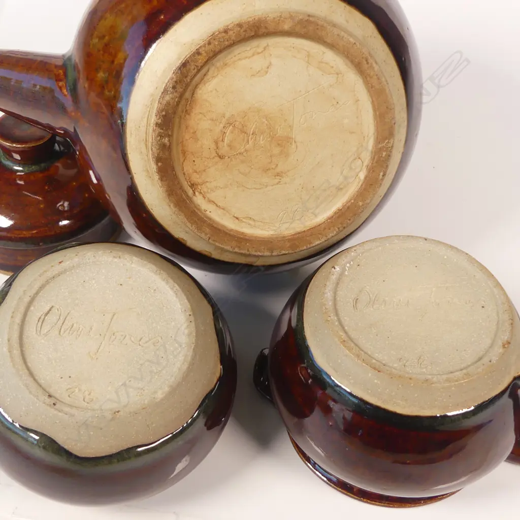 Olive Jones (1893-1982) early Rockingham-glazed teaset; cane handled teapot sugar bowl and milk jug, thick brown glaze. All signed and dated to base '28 Image 1++