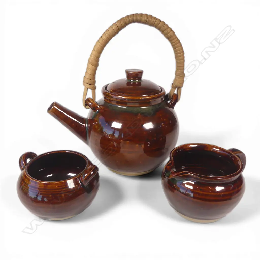 Olive Jones (1893-1982) early Rockingham-glazed teaset; cane handled teapot sugar bowl and milk jug, thick brown glaze. All signed and dated to base '28 Image 1++