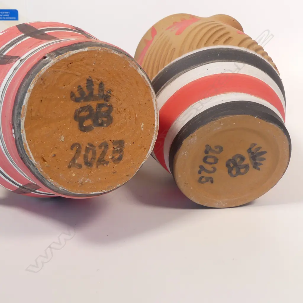 Two Anneke Borren terracotta jugs, glazed and painted interior, unglazed and painted exterior. Each with potter's mark. Dated 2025. H.200 H.155mm. Ex. Anneke Borren Collection. Image 1++