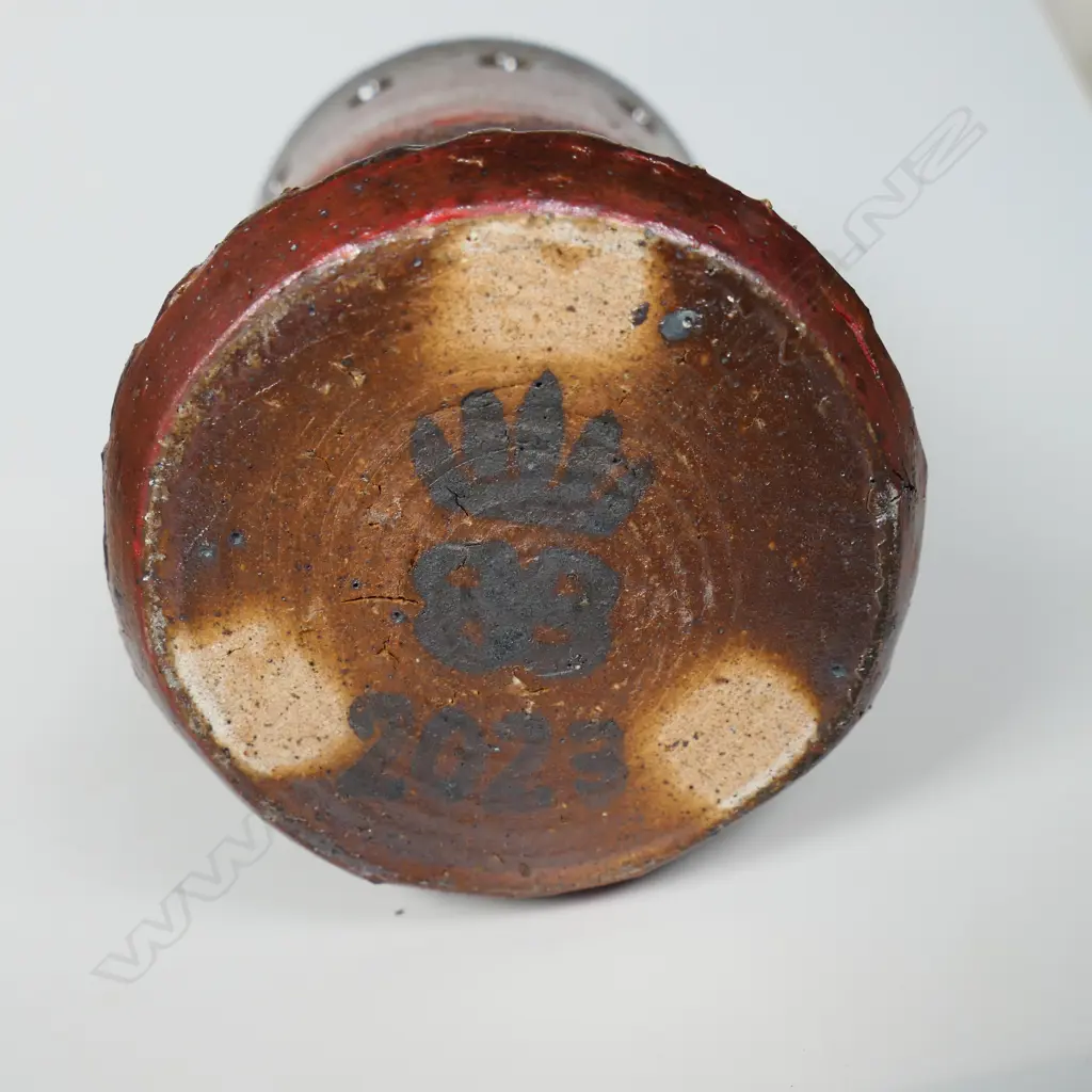 Anneke Borren small wood-fired vase, dark earthen lustre glaze, lower section with incised decoration, upper with ring of pierced circles. Potter's mark to base. H.125mm. Ex. Anneke Borren Collection. Image 1++