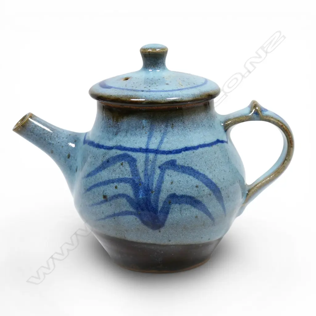 Peter Stichbury, light blue chun glazed tea pot with wax resist brushed floral pattern, impressed potter's mark.H.165mm. Image 1++