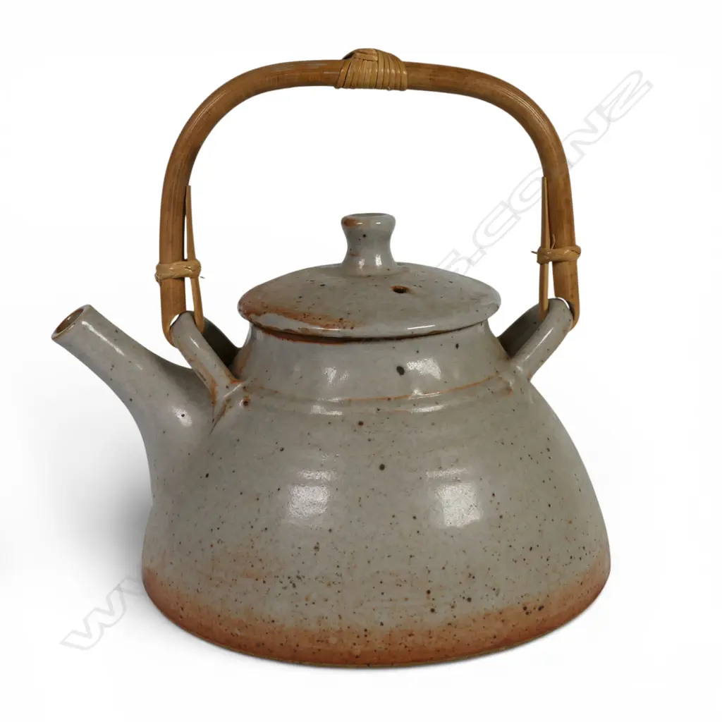 Peter Stichbury, Shino glazed tea pot with overhead bamboo handle, impressed potter's mark. H.220mm Dia.180mm. Image 1++