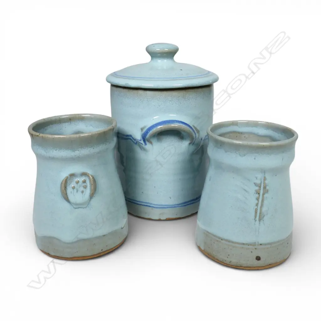 Peter Stichbury, two light blue glazed mugs with impressed decoration H.165mm and lidded jar H.210mm, all with potter's mark. Image 1++