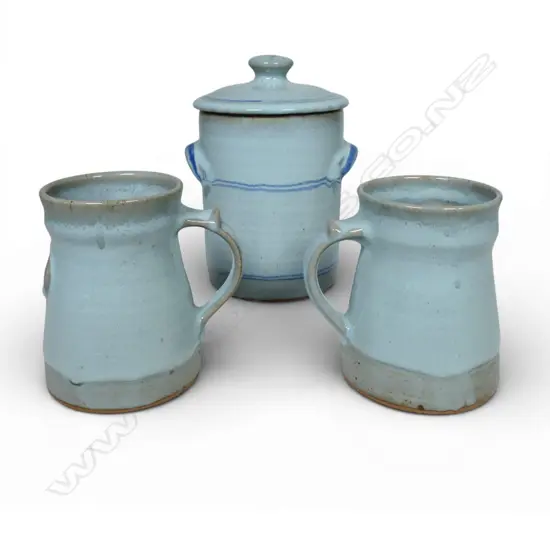 Peter Stichbury, two light blue glazed mugs with impressed decoration H.165mm and lidded jar H.210mm, all with potter's mark.