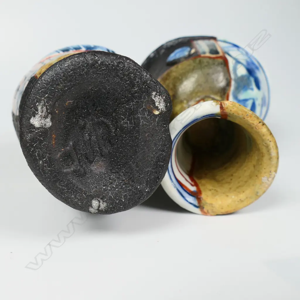 An Aaron Scythe yobitsugi style vase and goblet, distinct panelled sections of dark matte slips, and porcelain featuring bright blue and white overglaze decoration. H.170 & 105mm. Ex. Anneke Borren Collection. Image 1++