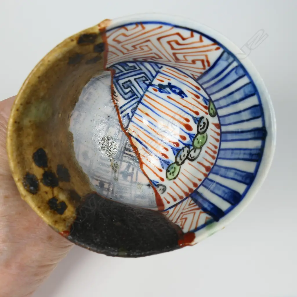 An Aaron Scythe yobitsugi style vase and goblet, distinct panelled sections of dark matte slips, and porcelain featuring bright blue and white overglaze decoration. H.170 & 105mm. Ex. Anneke Borren Collection. Image 1++