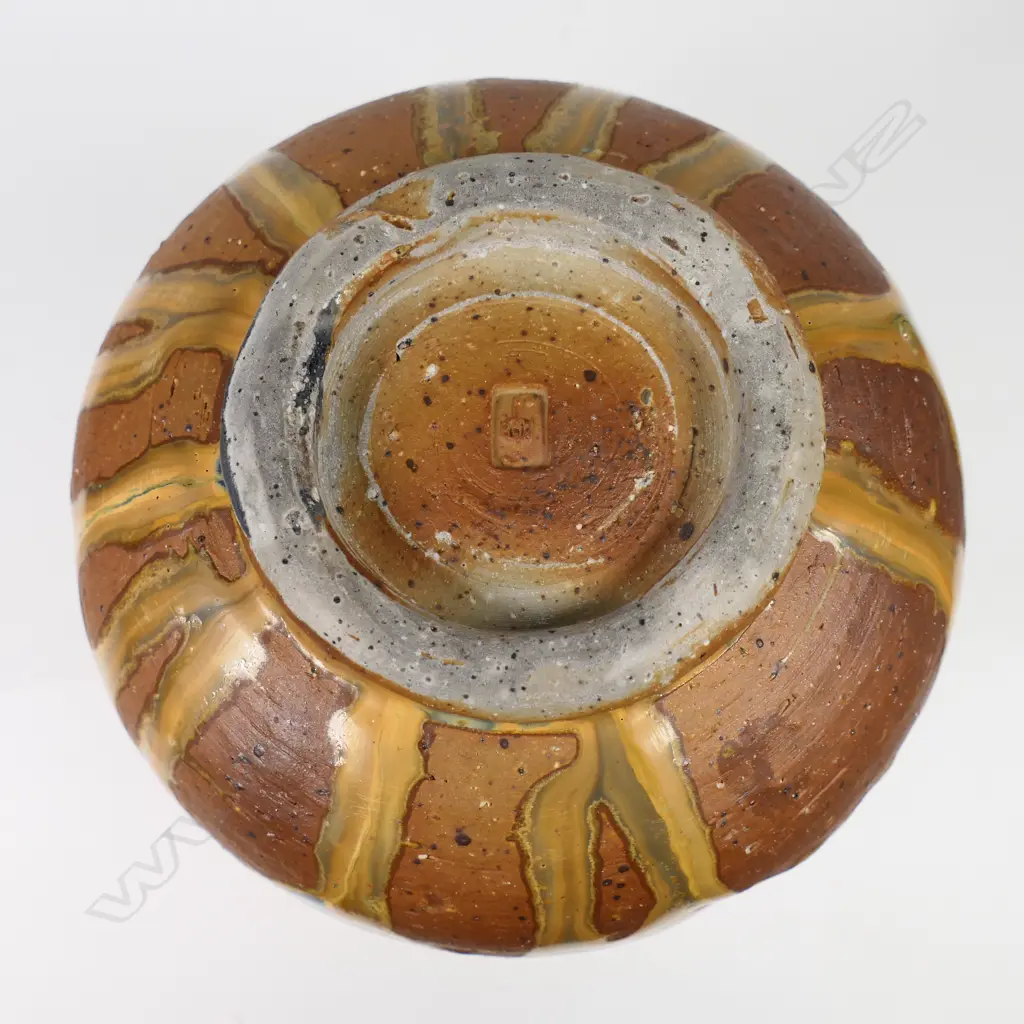 Greg Barron woodfired altered form vessel with dimples, drip glazed in earth-coloured tones, H.200 x Dia.130mm, maker's mark to base Image 1++