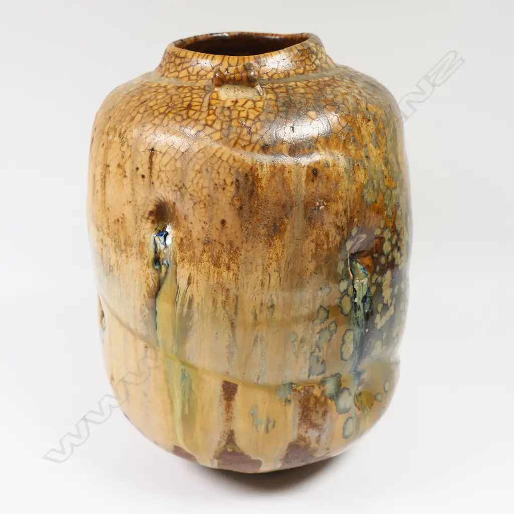 Greg Barron woodfired altered form vessel with dimples, drip glazed in earth-coloured tones, H.200 x Dia.130mm, maker's mark to base Image 1++