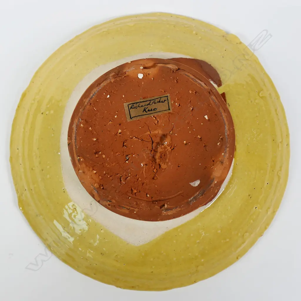 Richard Parker, stoneware dish, tan glaze with geometric pattern to centre. Small glaze fault to rim. Potter's label to base. Dia.215mm. Ex. Anneke Borren Collection. Image 1++