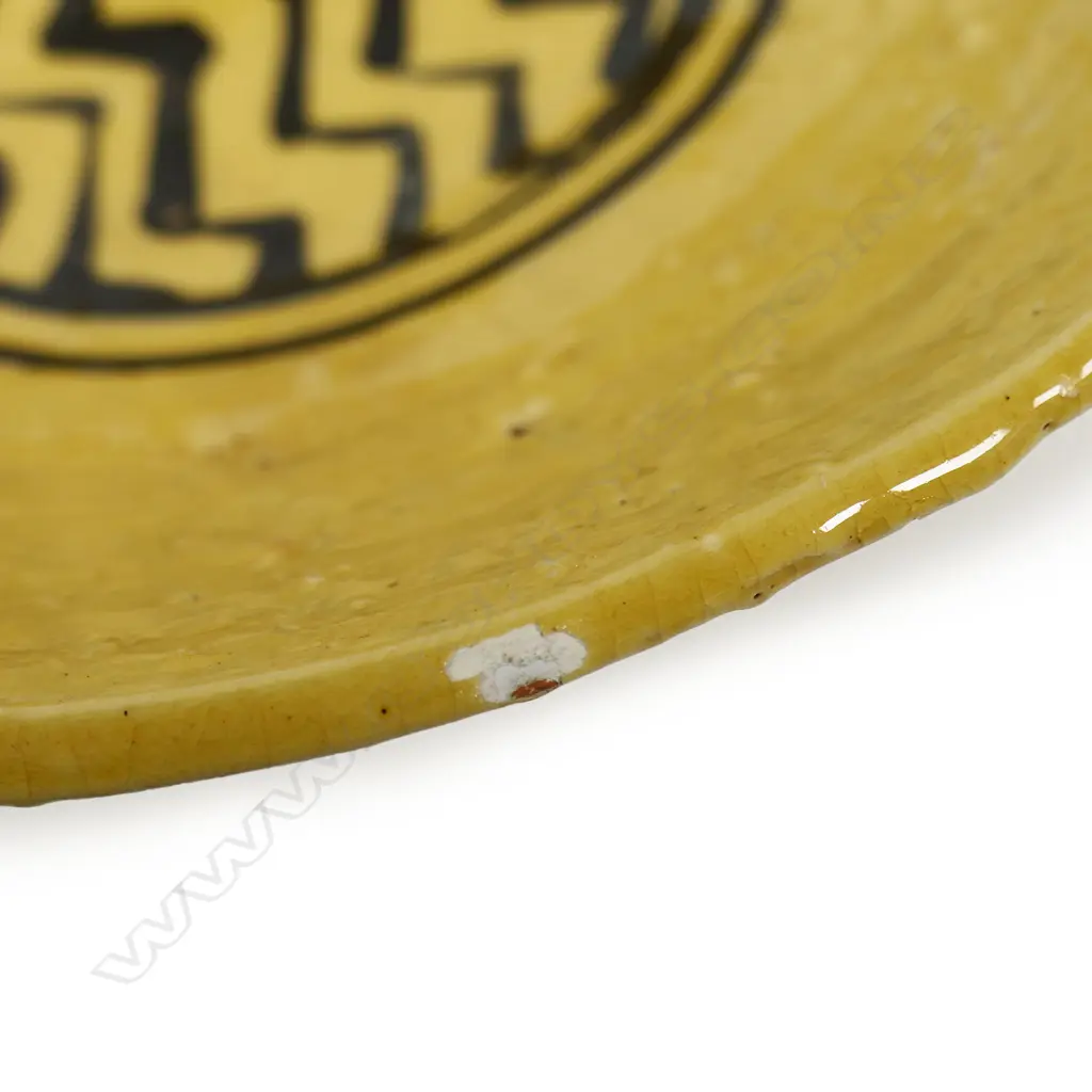 Richard Parker, stoneware dish, tan glaze with geometric pattern to centre. Small glaze fault to rim. Potter's label to base. Dia.215mm. Ex. Anneke Borren Collection. Image 1++