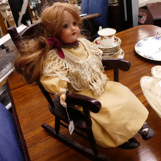 ANTIQUE CHINA DOLL IN CHAIR
