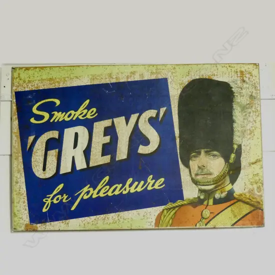A vintage Greys' Cigarettes tin outdoor advertising sign