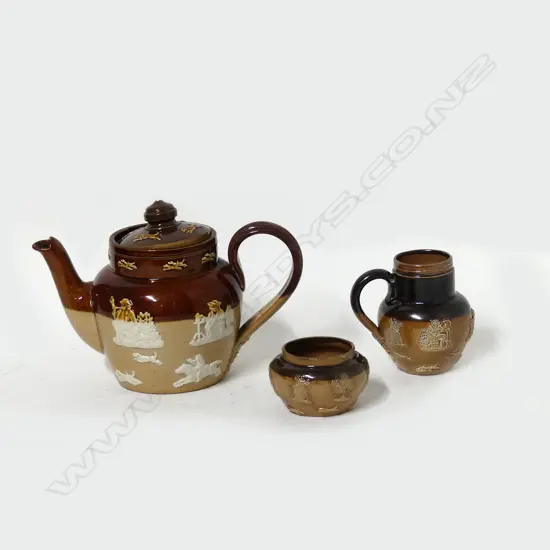A Doulton three piece miniature tea set