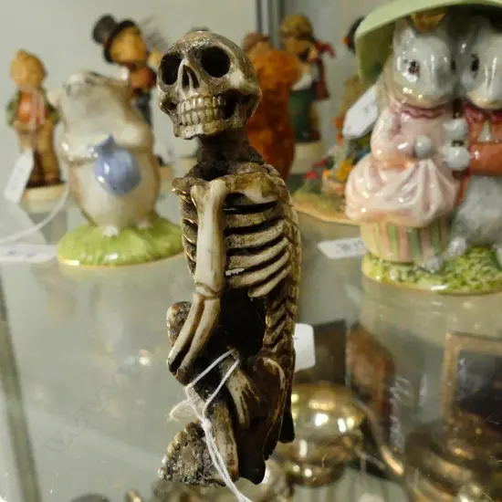 ANTLER CARVED SEATED SKELETON