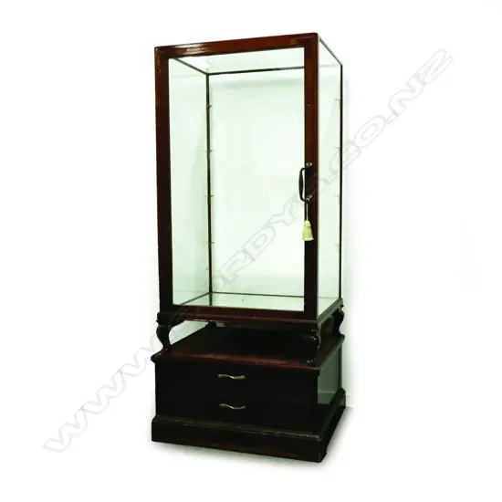 A 1920s mahogany framed and glazed shop display cabinet of compact size