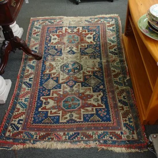 ANTIQUE PERSIAN RUG SHOWING SOME WEAR