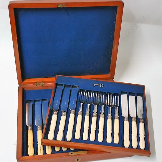 A late Victorian silver plate set of 12 dessert knives and forks