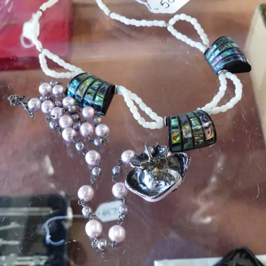 2 NECKLACES; PINK ENAMEL FLOWER + DECO STYLE PAUA (AF)