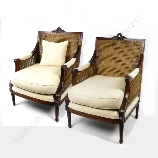 A pair of substantial mahogany framed bergère armchairs
