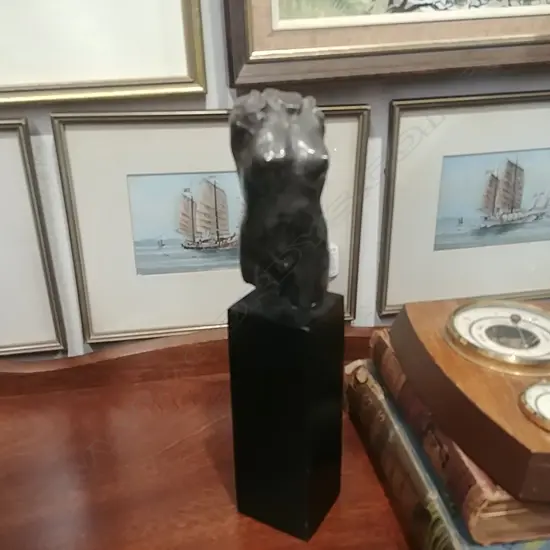METAL TORSO SCULPTURE ON EBONIZED PLINTH