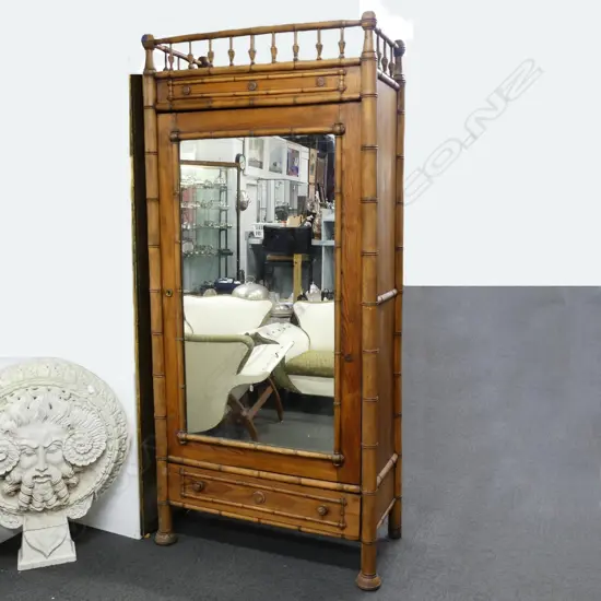 A late 19thC faux bamboo wardrobe