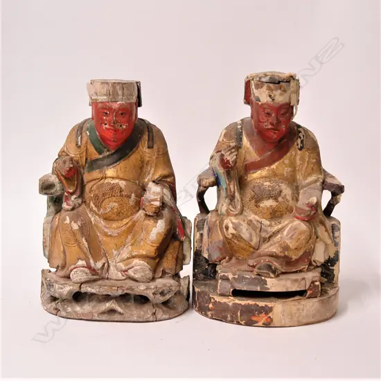 A pair of old Chinese carved wood seated deity figures