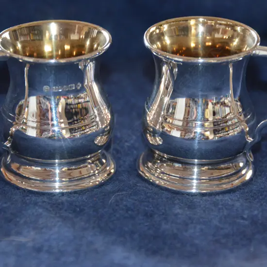 PAIR OF MINI SILVER TANKARDS 2000