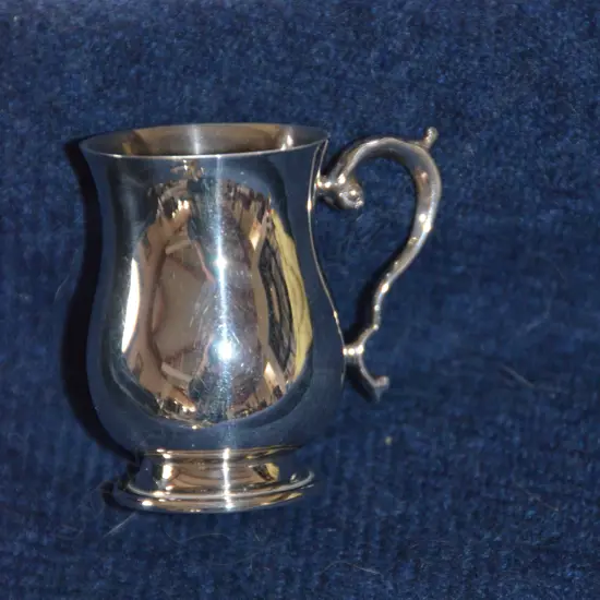 A MINI SILVER TANKARD 1997